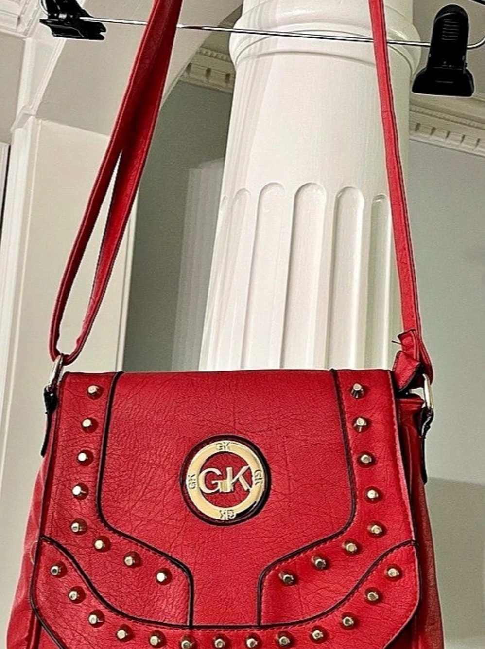 G K  Red Studded Crossbody textured Foux leather bag with circular gold tone log